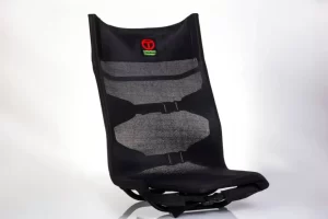 Ergonomic black mesh chair back support.
