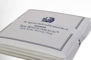 Ritz-Carlton treatment book with logo.