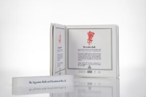 Bath and treatment book with instructions displayed.