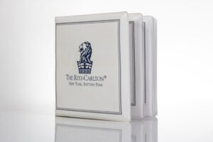 Ritz-Carlton hotel coasters with lion logo.