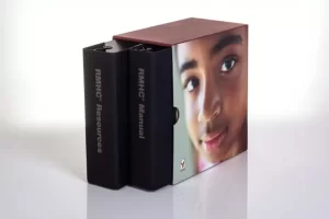 Binders with child's face on cover.