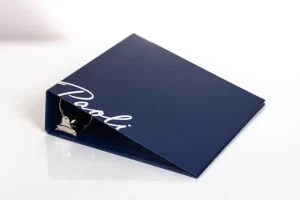 Blue binder with white text and clip.