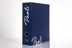 Blue binder with "Paoli" written on it.