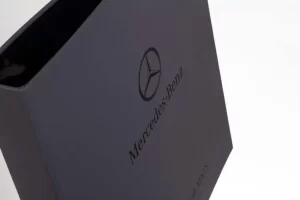 Mercedes-Benz branded blue binder on display.