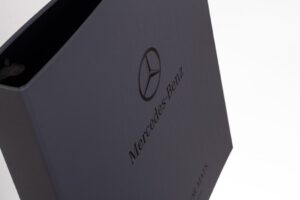 Mercedes-Benz branded binder, angled view.