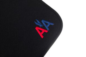 Black fabric with red and blue embroidery.
