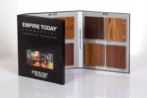 Laminate flooring sample booklet with wood textures.