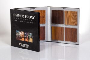 Laminate flooring sample booklet with wood swatches.