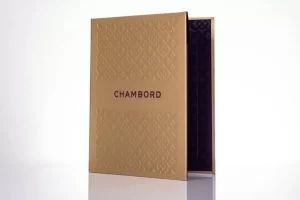 Gold Chambord box with embossed pattern.