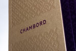 Gold Chambord packaging with embossed pattern.