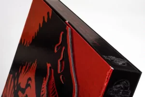 Red and black dinosaur-themed box corner.