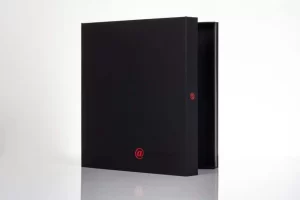 Black album with red "@" symbol.