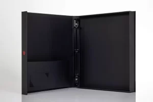 Black open binder with folder pockets.