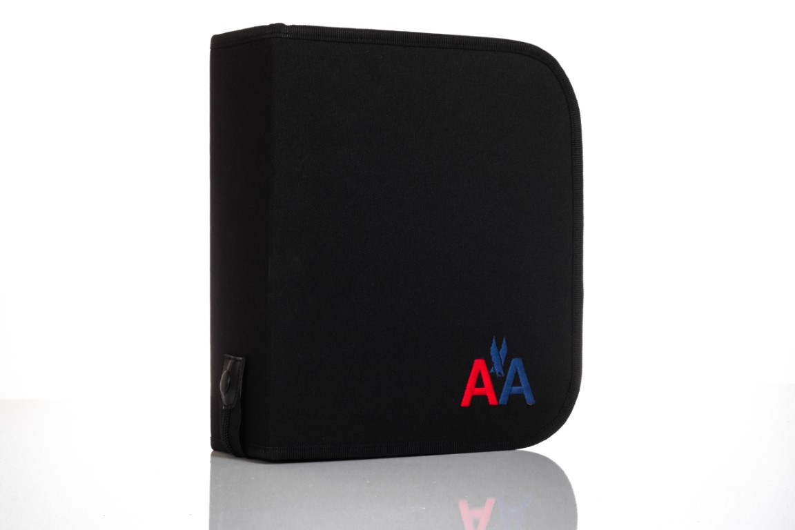 Black binder with red and blue logo.