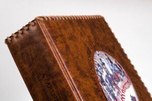 Brown leather-bound book with decorative stitching.