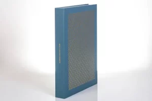 Blue hardcover book with decorative pattern.