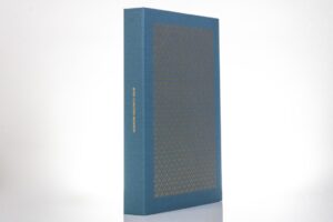Blue hardcover book with decorative pattern.