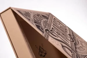 Decorative box with intricate black illustrations.