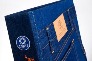 Denim-themed book with pocket and label design.