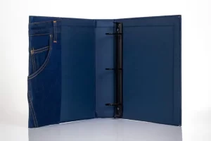 Denim-style binder with three-ring mechanism.