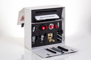 Box with various mechanical components and tools.