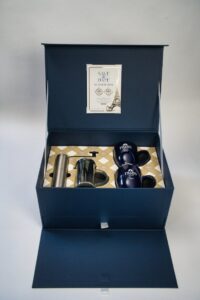Blue gift box with mugs and accessories.