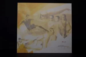 Abstract collage with dancers in warm tones.