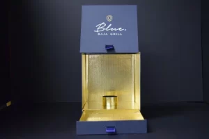 Blue Baja Grill golden box packaging display.