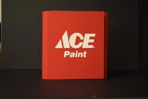 Red Ace Paint sample book on display.