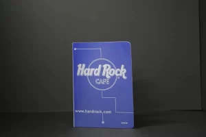 Hard Rock Cafe notebook against black background.