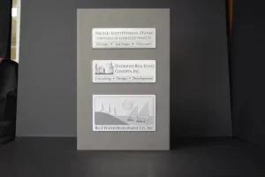 Plaque with company names and logos displayed.