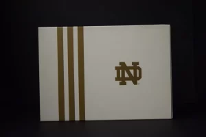 White box with gold stripes and logo.