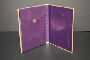Purple open card with decorative patterns.