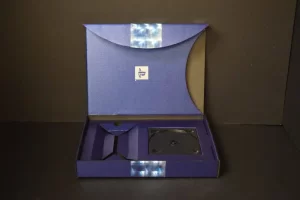 Open blue CD packaging box on display.