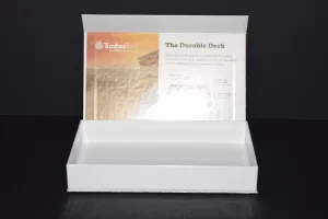 Open white box with brochure inside.