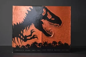 Orange dinosaur-themed box with black silhouette design.
