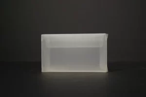 Transparent rectangular container on dark background.