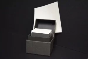 Box of index cards with paper background.