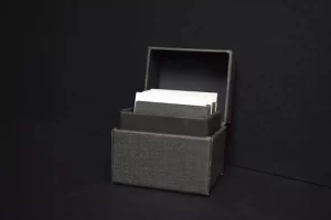 Box with index cards on dark background.