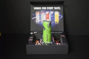 Green energy drink can in promotional box.