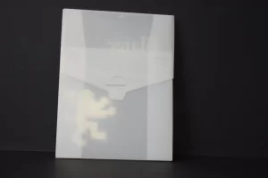 Transparent folder against black background.