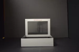 Open gray box with transparent lid.