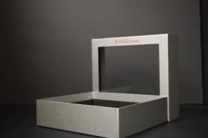 Open silver box with lid raised.