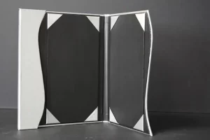 Open empty photo frame standing upright. Open empty photo frame standing upright.