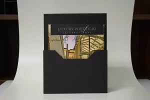 Luxury real estate brochure in black folder. Luxury real estate brochure in black folder.