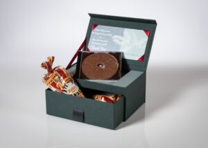 Gift box with chocolate and card.