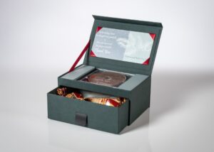 Gift box with CD and chocolates inside.