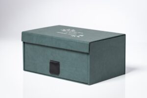 Green storage box with a closed lid.