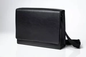 Black leather messenger bag with strap.