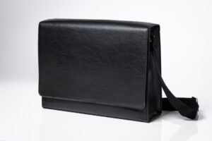 Black leather messenger bag with strap.